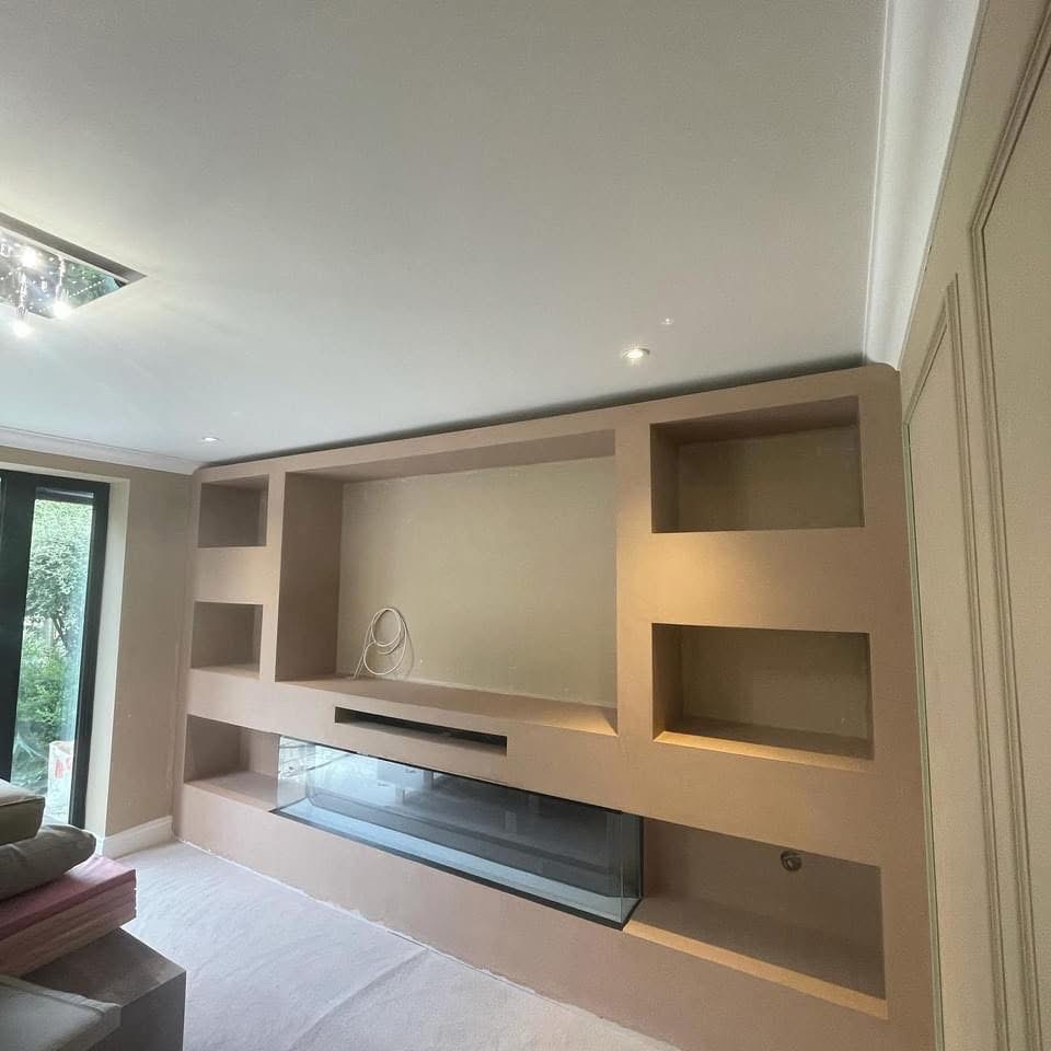Built-in fireplace and shelving plaster finish